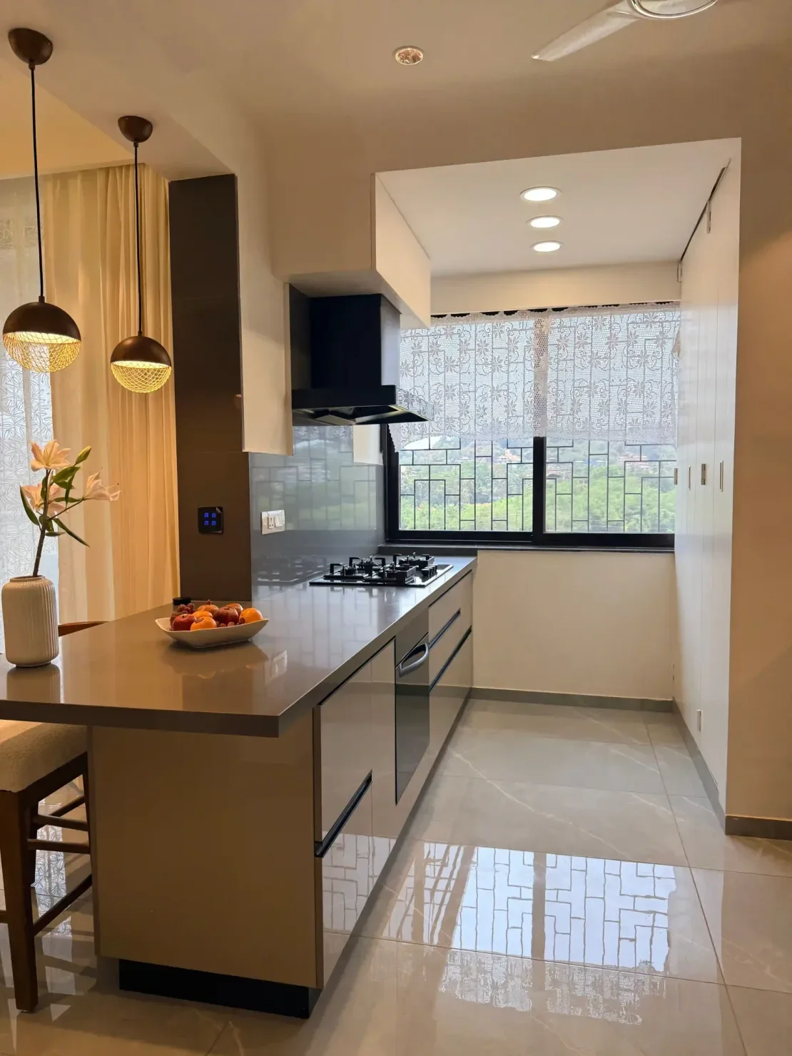 Contemporary kitchen with glossy large-format beige floor tile